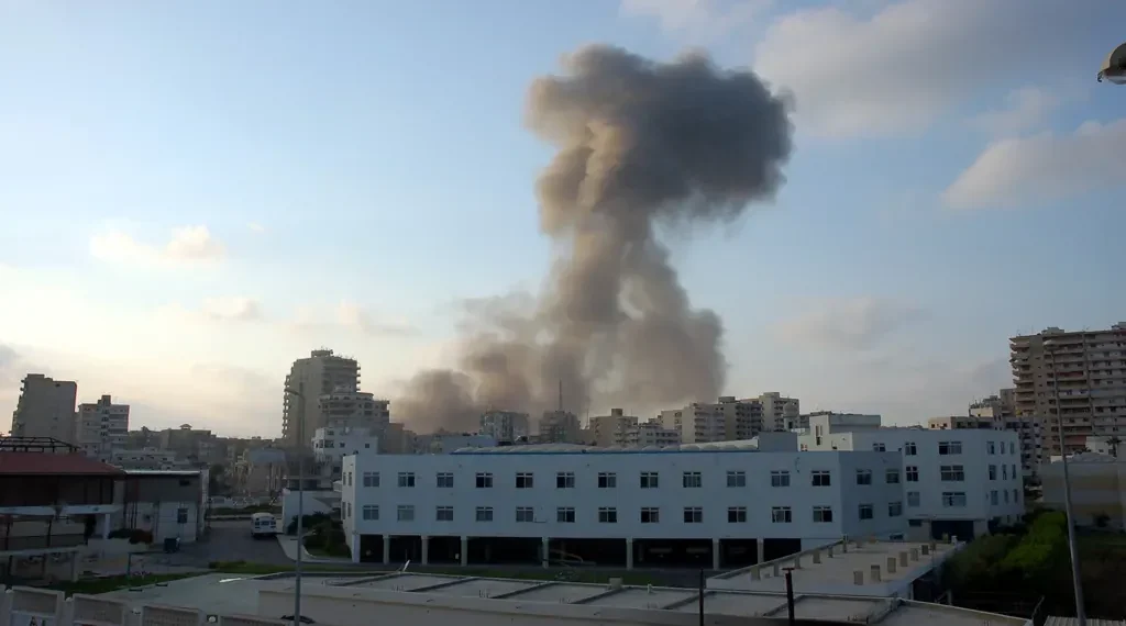 Dust rises over Tyre, Lebanon, after an Israeli airstrike during the 2006 Lebanon War on July 26, 2006.
