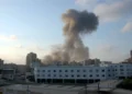 Dust rises over Tyre, Lebanon, after an Israeli airstrike during the 2006 Lebanon War on July 26, 2006.