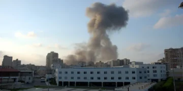Dust rises over Tyre, Lebanon, after an Israeli airstrike during the 2006 Lebanon War on July 26, 2006.