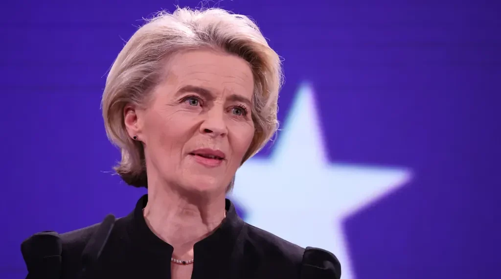 Ursula von der Leyen stands at a podium during a European ceremony honoring former Commission President Jacques Delors in Brussels.