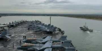 USS Abraham Lincoln aircraft carrier arrives at Laem Chabang, Thailand, during a 2006 Western Pacific deployment.