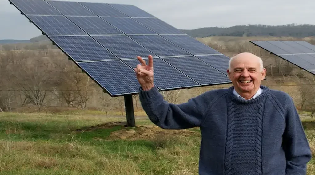 Wendell Berry stands beside solar panels on his farm in Henry County, Kentucky, in a photograph taken in 2011.