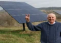 Wendell Berry stands beside solar panels on his farm in Henry County, Kentucky, in a photograph taken in 2011.