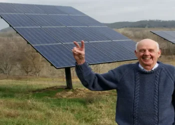 Wendell Berry stands beside solar panels on his farm in Henry County, Kentucky, in a photograph taken in 2011.