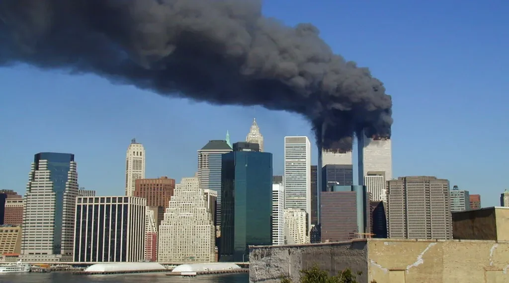 Plumes of smoke rise from the World Trade Center towers in Lower Manhattan after the September 11 attacks on September 11, 2001.