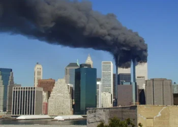 Plumes of smoke rise from the World Trade Center towers in Lower Manhattan after the September 11 attacks on September 11, 2001.