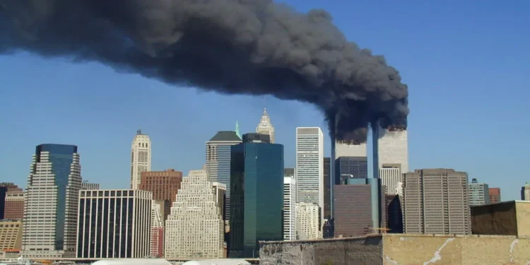 Plumes of smoke rise from the World Trade Center towers in Lower Manhattan after the September 11 attacks on September 11, 2001.
