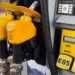 Yellow gasoline pump displaying E85, E15, and Eco Unleaded fuel options at a service station.