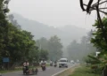 Haze and smog reduce visibility along the Medan–Banda Aceh road in Pidie Jaya District, Aceh, Indonesia, on October 24, 2015.
