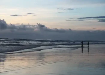 Dusk settles over Cox’s Bazar sea beach in Bangladesh, capturing the coastal landscape on September 14, 2013.