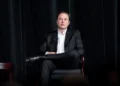 Elon Musk speaks with U.S. Air Force Academy Superintendent Lt. Gen. Richard Clark during a distinguished speaker presentation in Colorado Springs on April 7, 2022.
