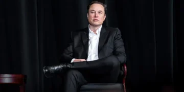 Elon Musk speaks with U.S. Air Force Academy Superintendent Lt. Gen. Richard Clark during a distinguished speaker presentation in Colorado Springs on April 7, 2022.