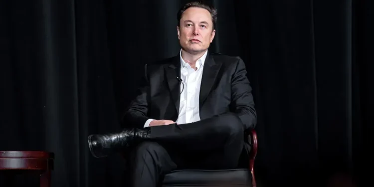 Elon Musk speaks with U.S. Air Force Academy Superintendent Lt. Gen. Richard Clark during a distinguished speaker presentation in Colorado Springs on April 7, 2022.