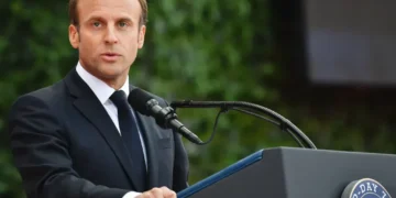 French President Emmanuel Macron speaks during the 75th D-Day anniversary ceremony at Normandy American Cemetery and Memorial in Colleville-sur-Mer, France, on June 6, 2019.