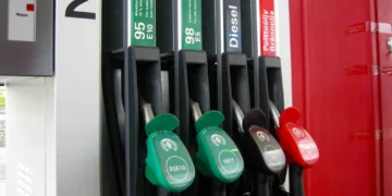 Fuel dispenser at a service station, photographed on June 17, 2016, showing multiple fuel nozzles and dispensing equipment.