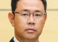 Genta Koja, governor of Okinawa Prefecture and former Naha deputy mayor, photographed during an official meeting documented by Japan’s Prime Minister’s Office on October 7, 2026.