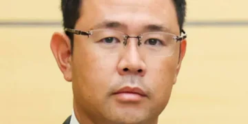Genta Koja, governor of Okinawa Prefecture and former Naha deputy mayor, photographed during an official meeting documented by Japan’s Prime Minister’s Office on October 7, 2026.