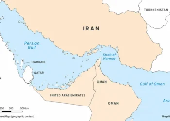 Map showing Iran and the Strait of Hormuz between the Persian Gulf and Gulf of Oman, with neighboring countries and the Arabian Sea labeled.