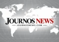 Journos News logo centered over a white world map on a gray background, with the website address JOURNOSNEWS.COM beneath the logo.