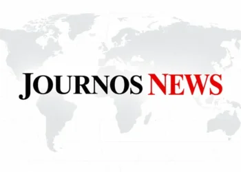 JournosNews wordmark in black and red centered over a pale gray world map on a clean white background.