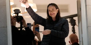 María Corina Machado greets a crowd from the front balcony of the Grand Hotel in Oslo, Norway, during Nobel Week in the early hours of December 11, 2025.