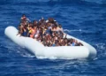 Migrants aboard an inflatable vessel approach USS Carney in the Mediterranean Sea on July 29, 2016, during a U.S. Navy rescue operation.