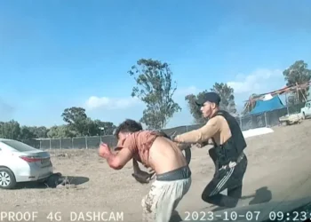 Dashcam image showing a militant kidnapping an Israeli civilian near the Nova music festival site at Re’im, Israel.
