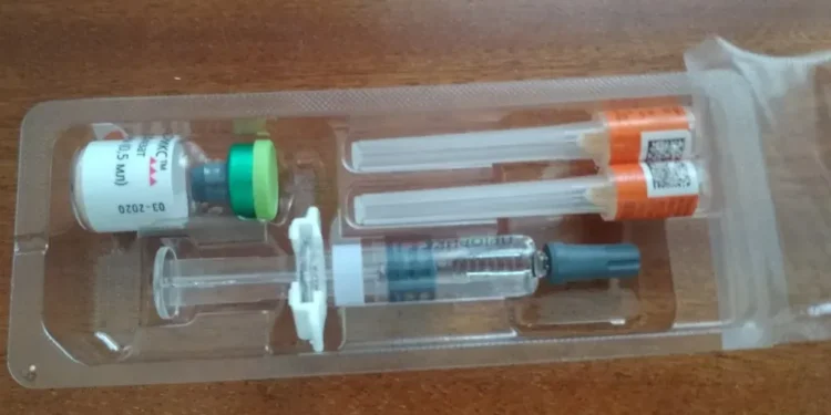 Priorix measles, mumps and rubella vaccine vial with a pre-filled solvent syringe and two protected hypodermic needles.